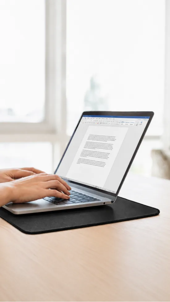 Velin Grounding Mat used as a desk pad under a laptop