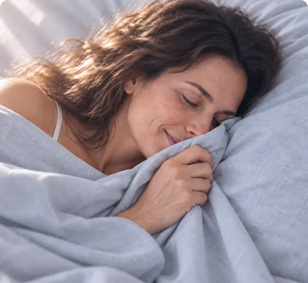 Woman resting her face on soft Velin bedding